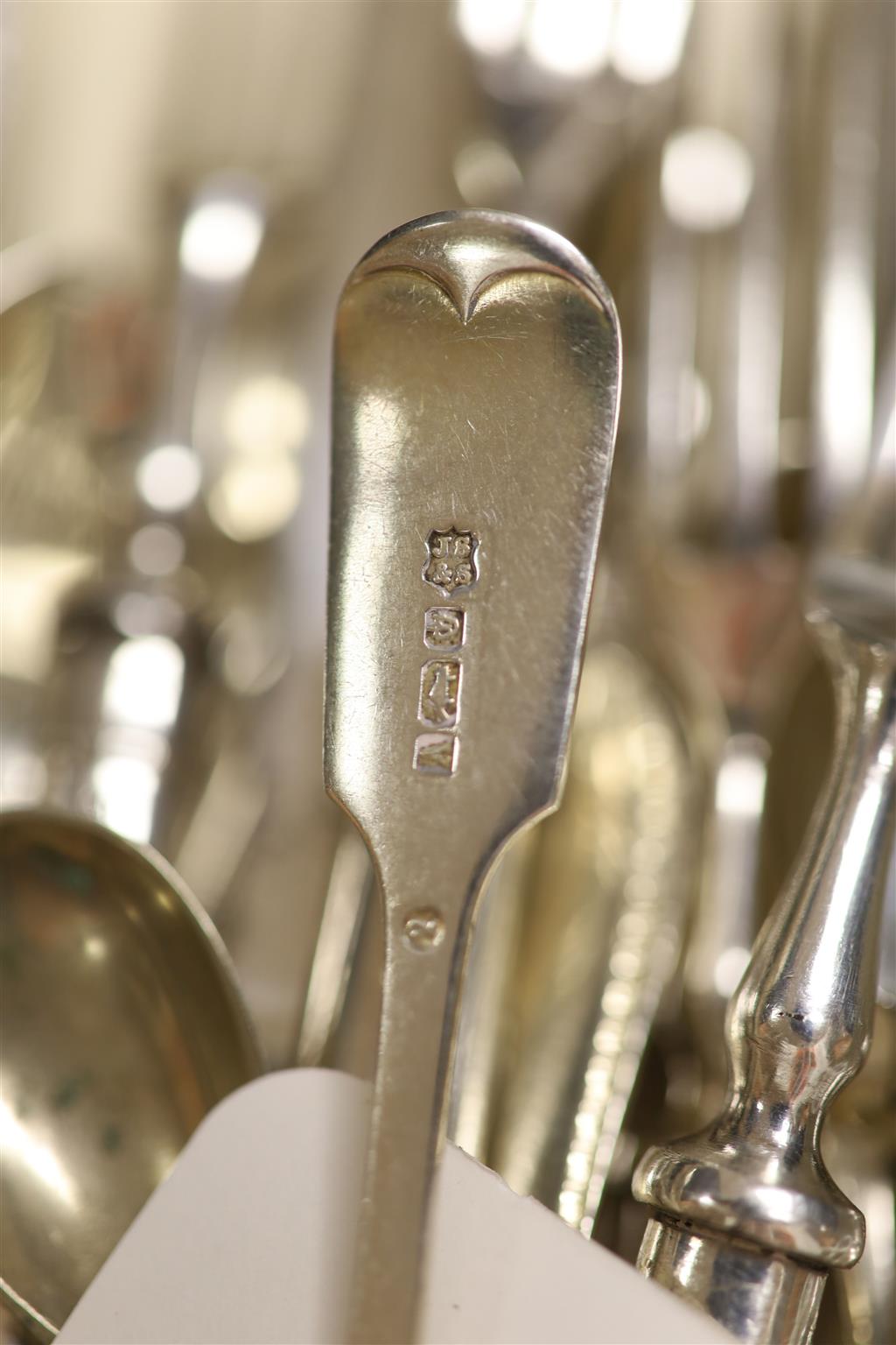 A set of six silver handled dessert forks, four silver handled dessert knives, a Georgian silver dessert fork, five silver teaspoons et